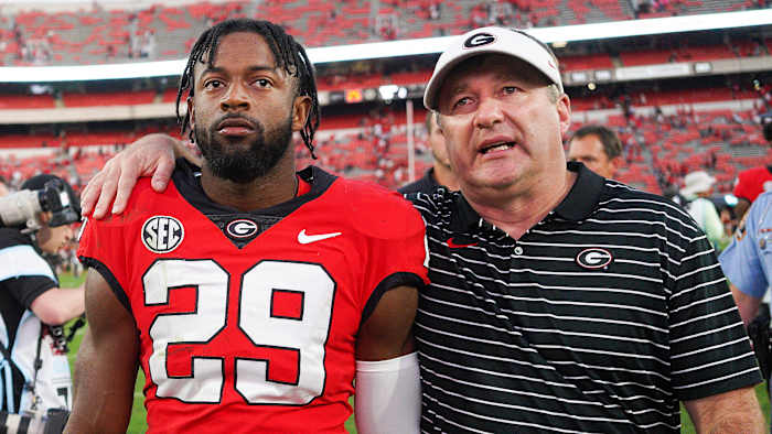 Georgia’s Kirby Smart puts his arm around DB Christopher Smith